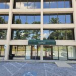 white building with big glass windows and numbers 10750 on awning