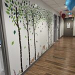 Hall with forest decor decals of trees and animals on wall